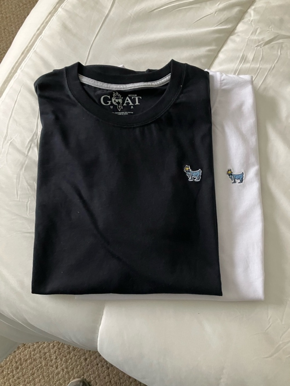 2 GOAT USA Men’s Medium Tee Shirts. 1 white & 1 black NWT